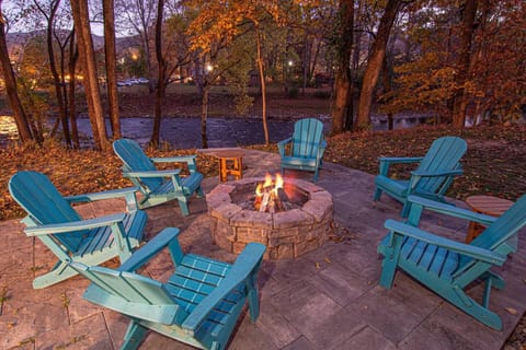 Cozy fire pit by the river on a beautiful fall evening.