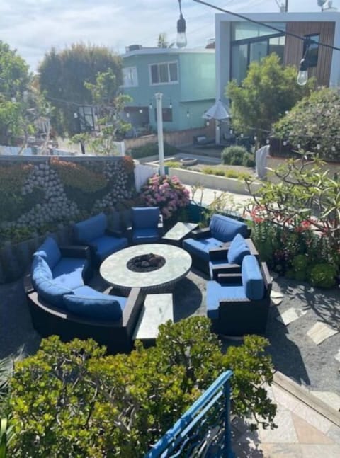 Firepit and succulent wall with seating for 9