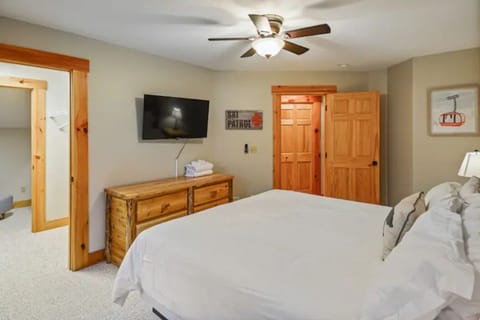 Bedroom #2 with king bed, nightstands, wide dresser, smartTV & home office.