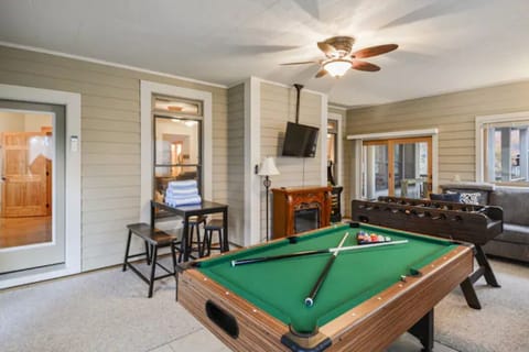 Game room w/ pool table, foosball, PacMan, GoldenTee, pub table, fireplace &  AC