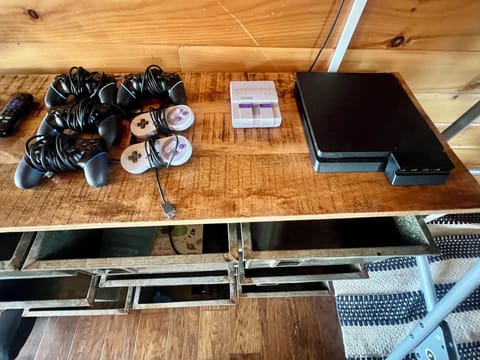 Cabin 2: Playstation and SuperNintendo consoles in gaming loft