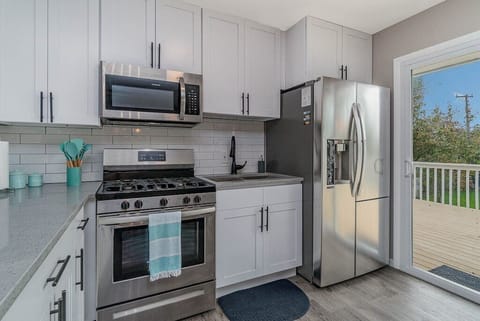 Updated kitchen with new stainless steel appliances.