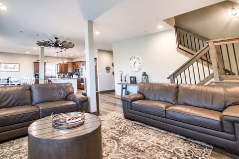 Sink right into the comfort of the couches while also enjoying the company of those in the kitchen!