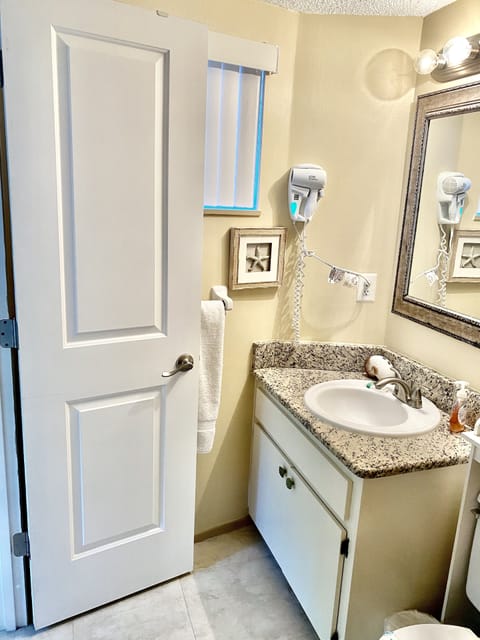 Combined shower/tub, hair dryer, towels, soap