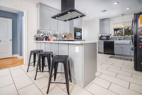 Large suburban house in quiet area with an open kitchen/dining/family area perfect for eating and lounging. -Luann