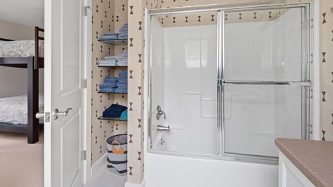 Combined shower/tub, hair dryer, towels, soap