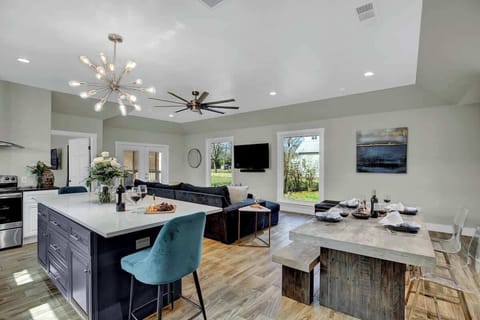 Eat a meal at the dining table or gather around the kitchen island.