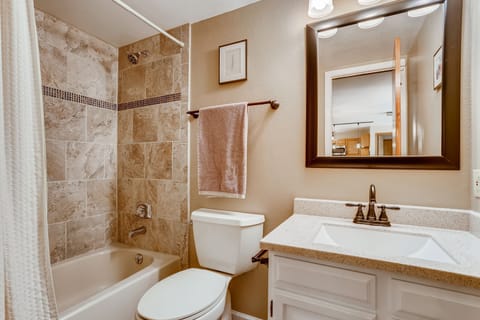 Combined shower/tub, hair dryer, towels, soap