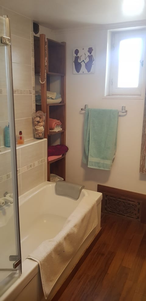 Combined shower/tub, hair dryer, towels, soap