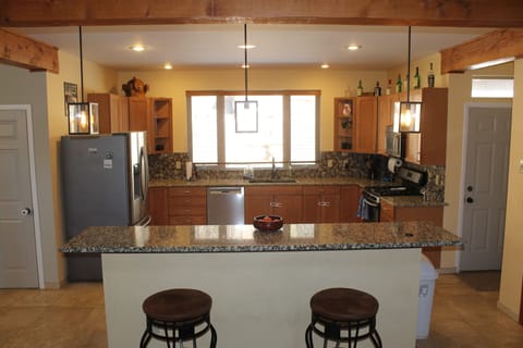 Large granite counter kitchen.