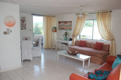 Spacious lounge with dining table for 4 ..sliding door leading to the balcony 