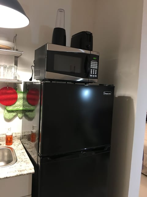 Fridge, microwave, coffee/tea maker, toaster