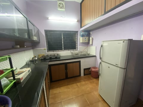 Fridge, stovetop, electric kettle, dining tables