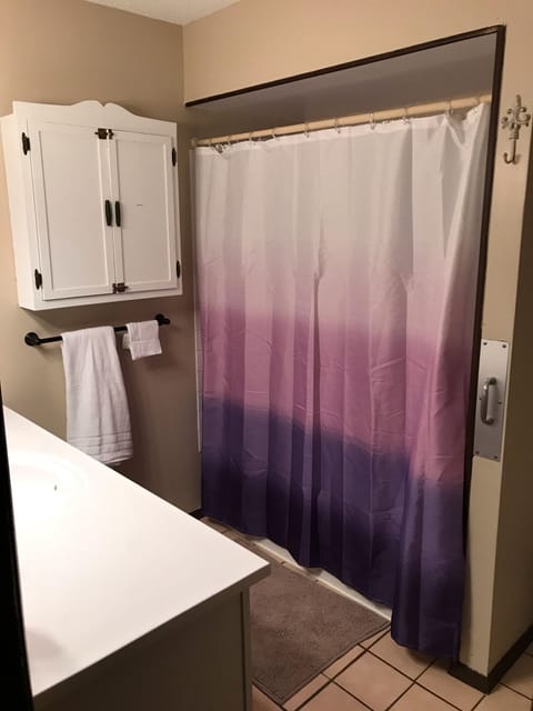 Combined shower/tub, hair dryer, towels, soap