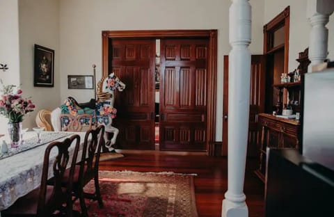 View from the dining room into the living room with doors closed.
