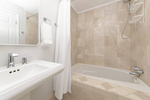 Combined shower/tub, hair dryer, towels, soap