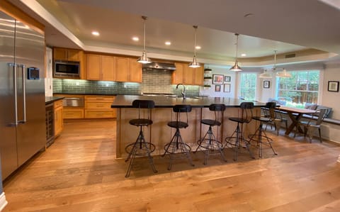 massive kitchen  island and "nook" seat your entire party (and then some)