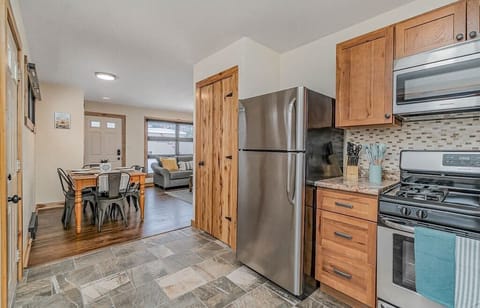 Fully stocked kitchen located right off of dining/living area.