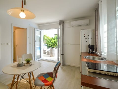 Furniture, Table, Property, Cabinetry, Countertop, Plant, Window, Wood, Interior Design