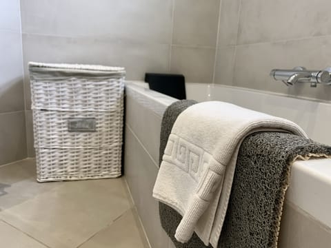 Bathtub, hair dryer, towels