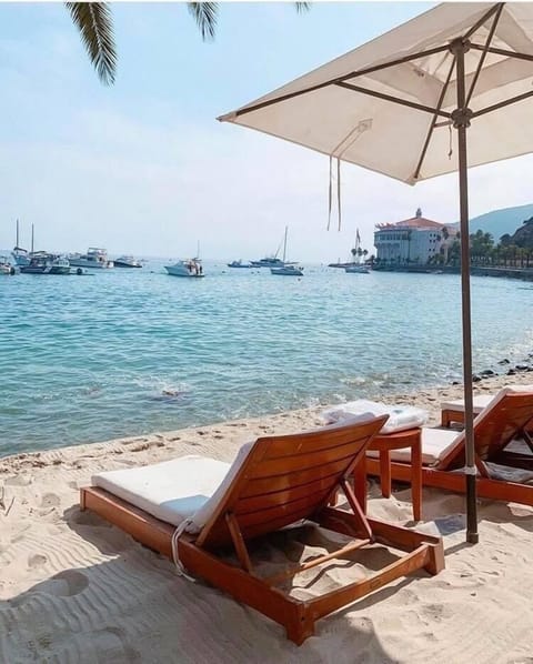 On the beach, sun loungers, beach towels