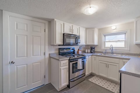 Traditional drip coffee maker, electric range, and over the range microwave!