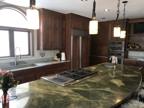 Kitchen Cooktop, Fridge, Microwave, Oven, and Coffee Station