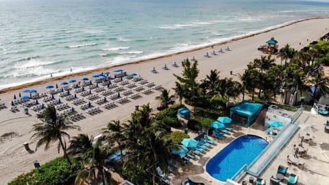 On the beach, sun loungers, beach towels