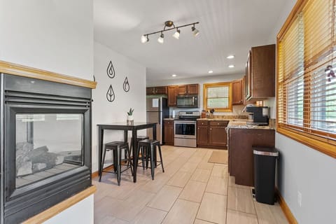 The fully equipped kitchen features additional seating