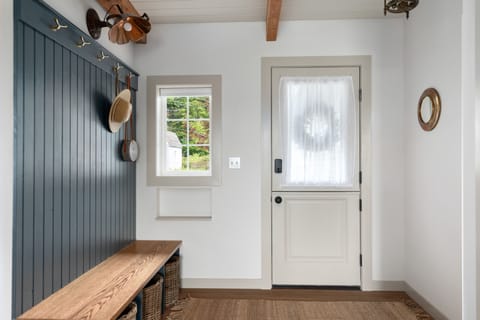 Front entry bench with hooks