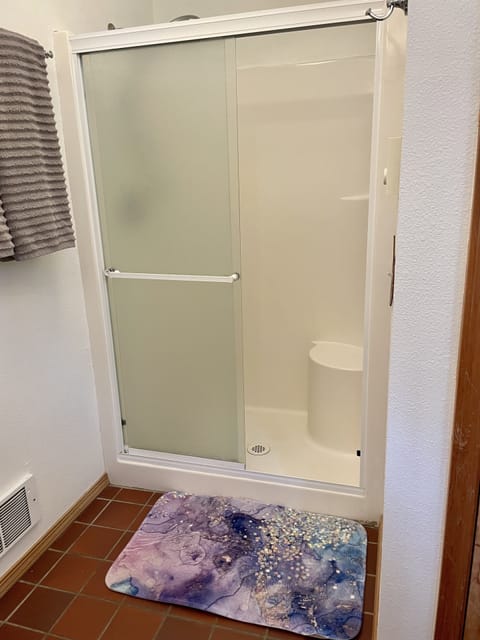 Combined shower/tub, hair dryer, towels, soap