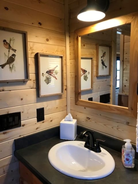 Full size bathroom with tub/shower combo