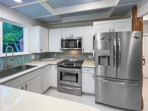 Well thought out kitchen with counter island area for easy prepping.