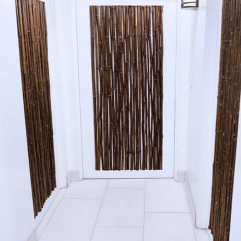 Stunning Designer Framed Hawaiian Themed Bamboo Doors Leading to Each Bedroom.
