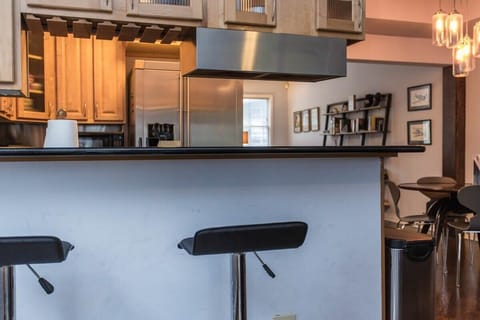 Bar stools for additional seating located on kitchen bar