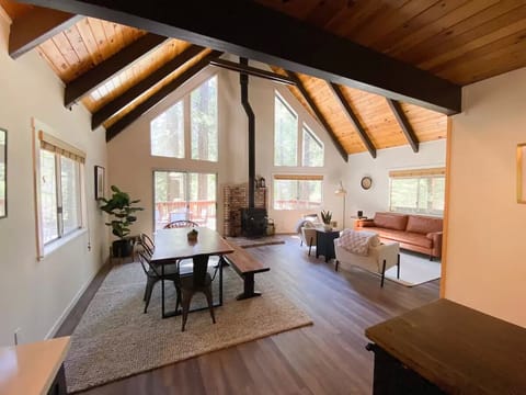 Open floor plan with large chalet windows