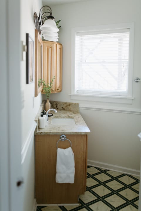 Combined shower/tub, hair dryer, towels, soap