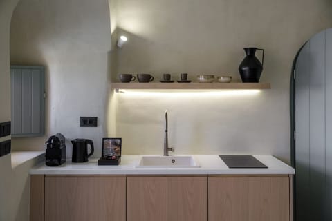 Kitchenette with coffee machine and kettle