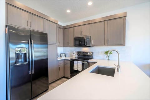 Stylish spacious kitchen with peninsula bar seating and dining