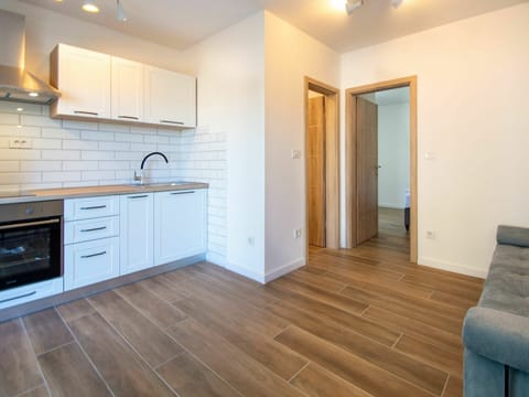 Cabinetry, Property, Countertop, Building, Sink, Wood, Tap, Lighting, Interior Design, Flooring