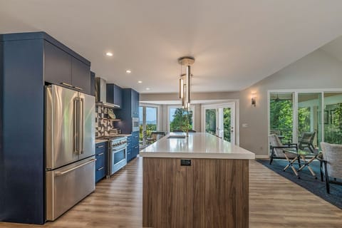 Quartz countertop with large-bowled sink and touch-less faucet