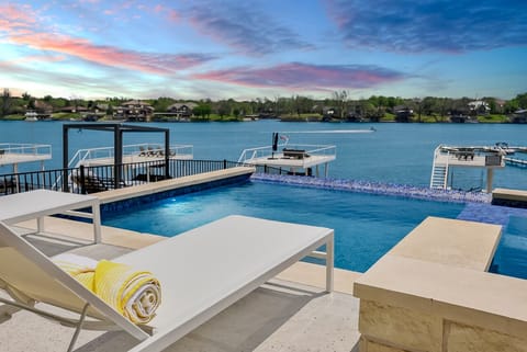 Lounge by the infinity pool and take in the beautiful views of Lake LBJ