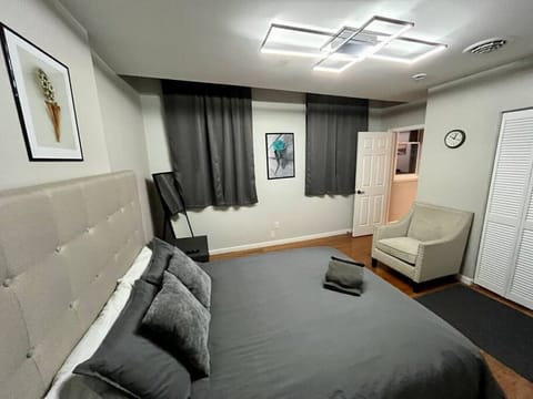 Bedroom - Queen bed, black out shades, Smart TV  and desk (out of sight)