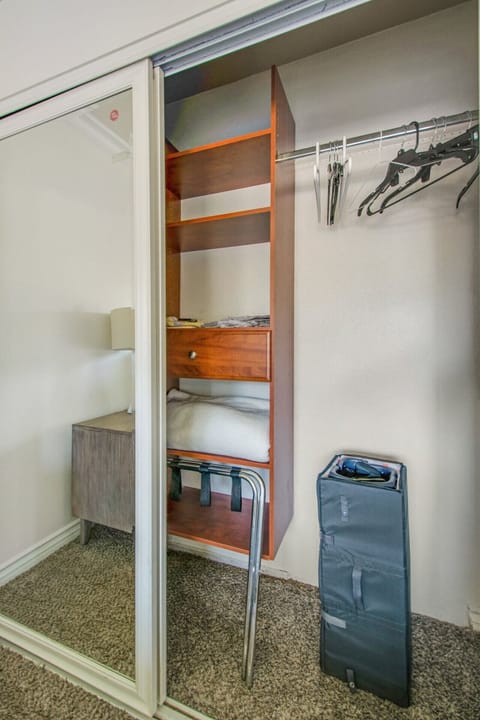 large closet with shelves at bedroom 2