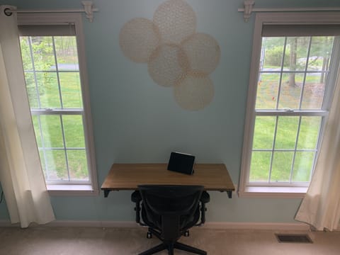 Working remotely is the new norm. Comfortable workspace with views of nature.