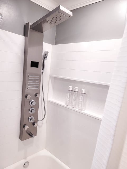 Combined shower/tub, hair dryer, towels, soap