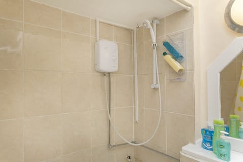 Combined shower/tub, hair dryer, towels, toilet paper