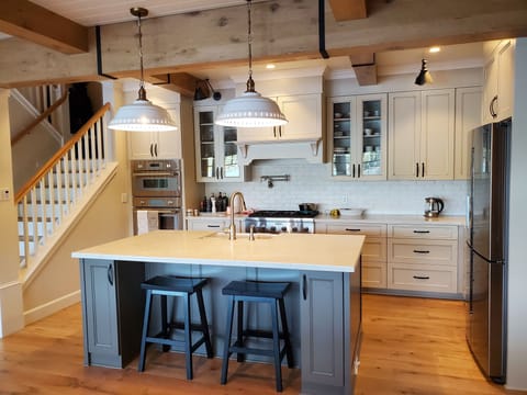 Kitchen with gas stove, double oven, microwave, kurig & nespresso machine etc.