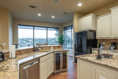 Granite tops and stainless steel appliances in kitchen