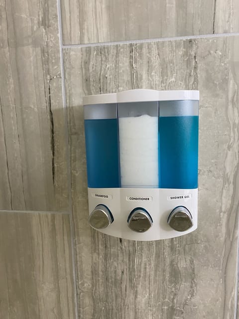 Combined shower/tub, hair dryer, towels, soap